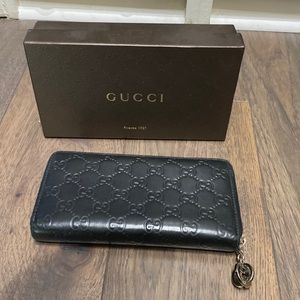 Gucci black guccissima wallet.